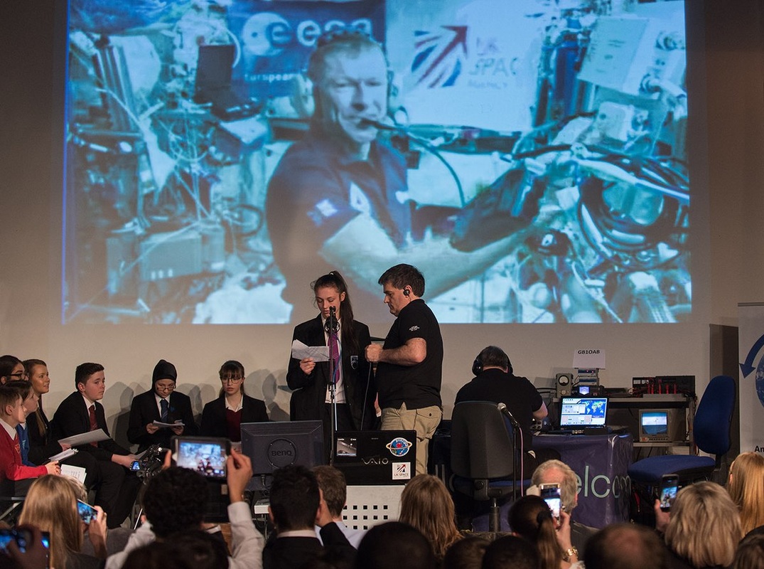 International Space Station Astronaut Communicating with Students through Amateur Radio ARISS